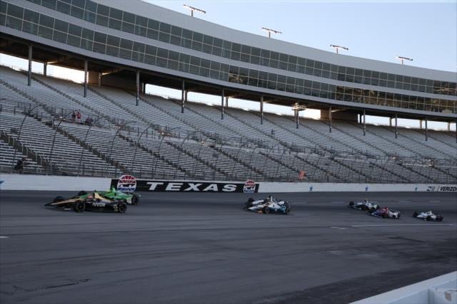 The field streams out of Turn 4 to start the DXC Technology 600 at Texas Motor Speedway -- Photo by: Chris Jones