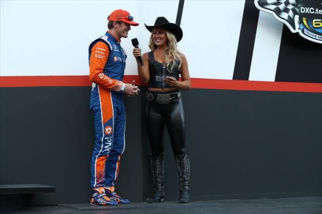 Scott Dixon is interviewed by a Great American Sweetheart on stage during pre-race festivities for the DXC Technology 600 at Texas Motor Speedway -- Photo by: Chris Jones