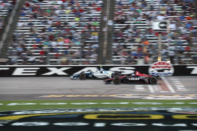 Max Chilton and Robert Wickens streak across the start-finish line during the DXC Technology 600 at Texas Motor Speedway -- Photo by: Chris Jones
