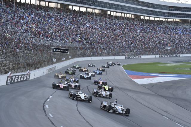 Josef Newgarden and Simon Pagenaud lead the field into Turn 1 during the start of the DXC Technology 600 at Texas Motor Speedway -- Photo by: Chris Owens
