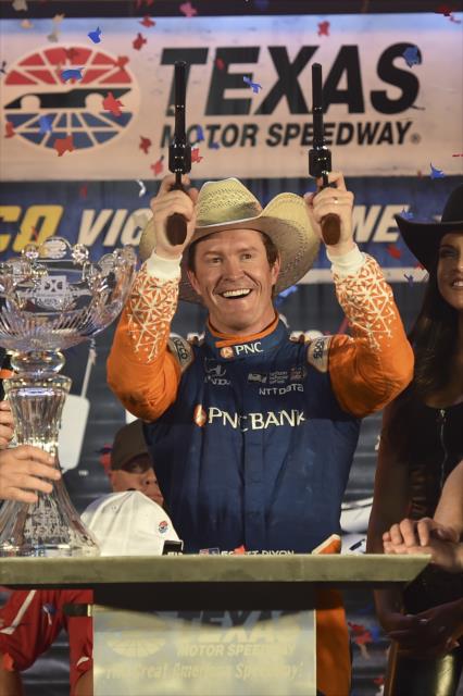 Scott Dixon fires of the six-shooters in Victory Lane after winning the DXC Technology 600 at Texas Motor Speedway -- Photo by: Chris Owens