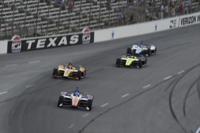Scott Dixon leads a group into Turn 1 during the DXC Technology 600 at Texas Motor Speedway -- Photo by: Chris Owens