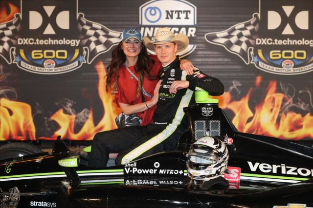 Josef Newgarden celebrates with his fiancÃ© Ashley after winning the DXC Technology 600 at Texas Motor Speedway -- Photo by: Chris Jones