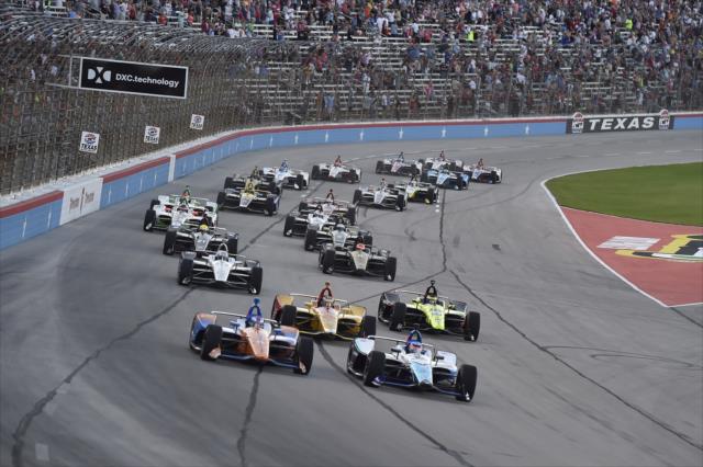 Takuma Sato and Scott Dixon lead a pack of cars to the green flag of the DXC Technology 600 at Texas Motor Speedway -- Photo by: Chris Owens