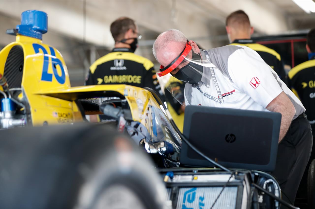 A Honda crew member works on the Andretti Autosport car of Zach Veach prior to the Genesys 300 at Texas Motor Speedway Saturday, June 6, 2020 -- Photo by: Joe Skibinski