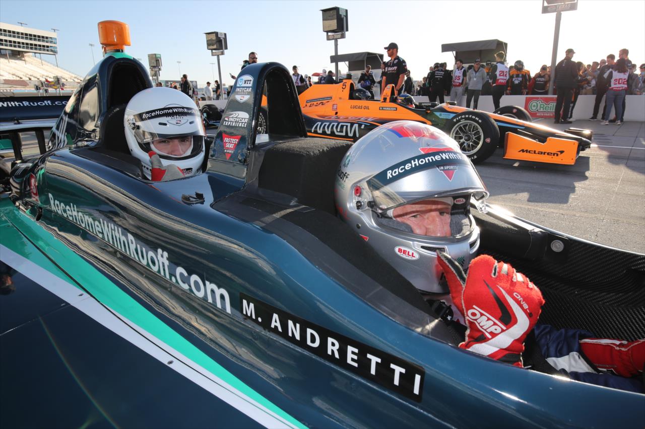 Rich Ellis riding in the Ruoff Fastest Seat in Sports with Mario Andretti - XPEL 375 - By: Joe Skibinski -- Photo by: Joe Skibinski