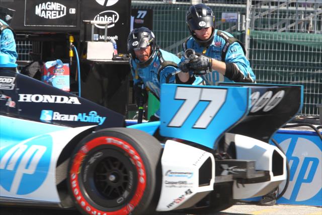 The Schmidt Hamilton Motorsports team sets into motion for a pit stop -- Photo by: Chris Jones