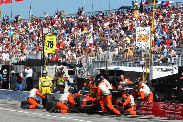 Tristan Vautier and the Schmidt Peterson Motorsports team perform an early pit stop -- Photo by: Chris Jones