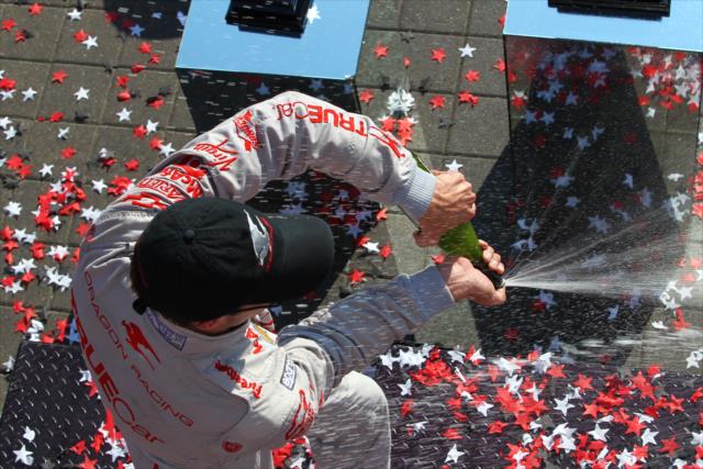 Sebastien Bourdais sprays the champagne in Victory Circle -- Photo by: Chris Jones