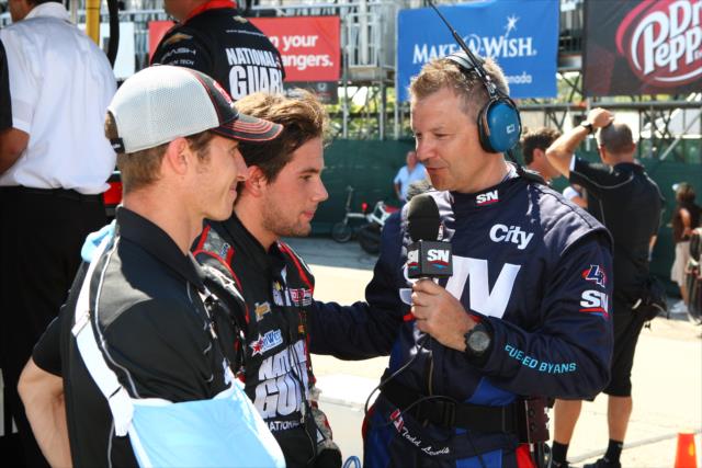 Carlos Munoz and Ryan Briscoe being interviewed by the media before practice -- Photo by: Chris Jones