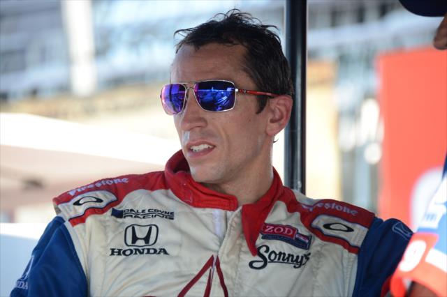 Justin Wilson debriefs with his team following the race -- Photo by: Chris Owens