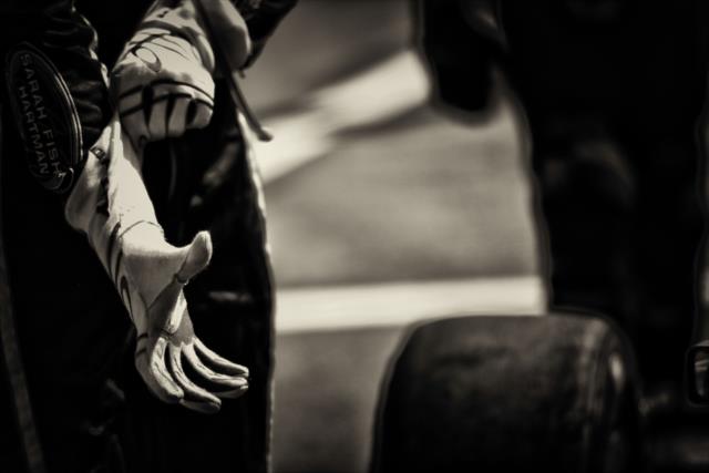 Josef Newgarden puts on his gloves before practice starts -- Photo by: Shawn Gritzmacher