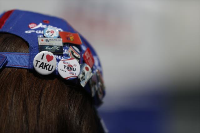 A Takuma Sato supporter shows off her gear -- Photo by: Shawn Gritzmacher