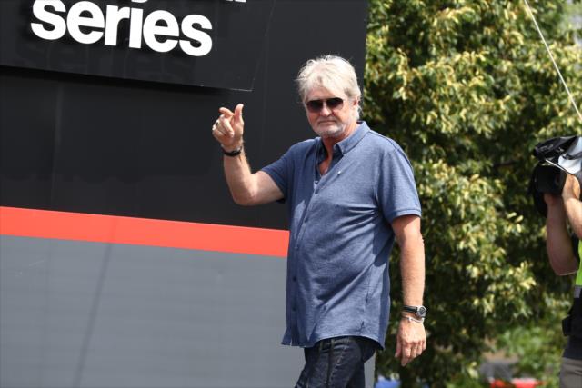 Grand Marshal Tom Cochrane waives to the crowd during pre-race festivities for the Honda Indy Toronto -- Photo by: Chris Jones
