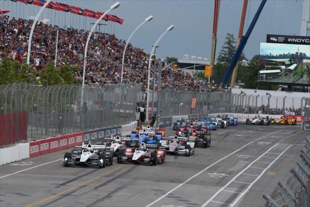 Simon Pagenaud and Graham Rahal lead the field to the green flag to start the Honda Indy Toronto -- Photo by: Chris Jones