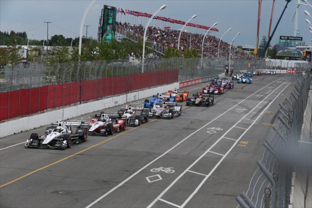 Simon Pagenaud leads the field down the frontstretch to start the Honda Indy Toronto -- Photo by: Chris Jones