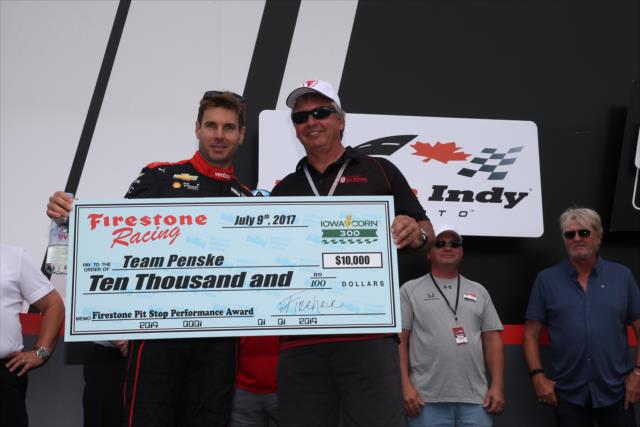 Will Power accepts the Firestone Pit Stop Performance Award on behalf of Team Penske for their performance at Iowa during pre-race festivities for the Honda Indy Toronto -- Photo by: Chris Jones