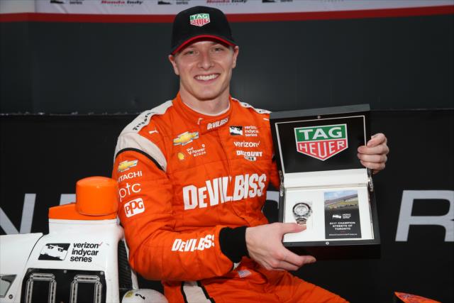 Josef Newgarden with his TAG Heuer Winner's Watch in Victory Circle after winning the Honda Indy Toronto -- Photo by: Chris Jones