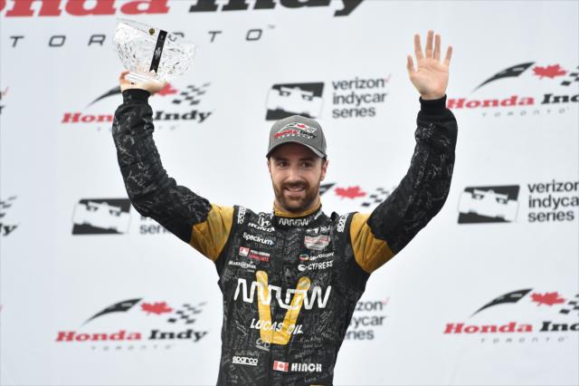 James Hinchcliffe waives to the Toronto fans from Victory Circle with his 3rd Place trophy following the Honda Indy Toronto -- Photo by: Chris Owens