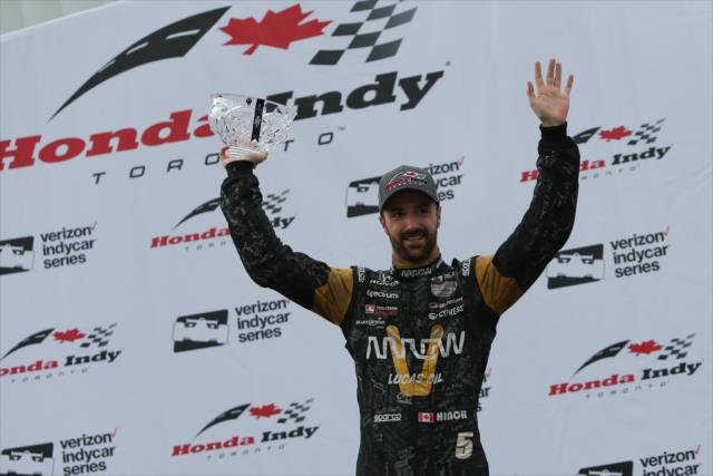 James Hinchcliffe accepts his 3rd Place trophy in Victory Circle following the Honda Indy Toronto -- Photo by: Joe Skibinski