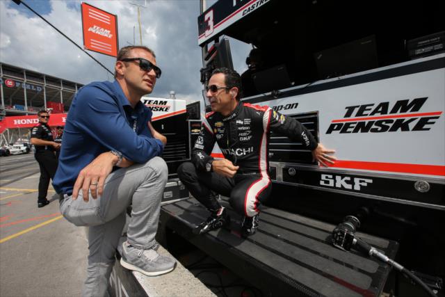 NBC Reporter Townsend Bell chats with Helio Castroneves along pit lane following the final warmup for the Honda Indy Toronto -- Photo by: Joe Skibinski