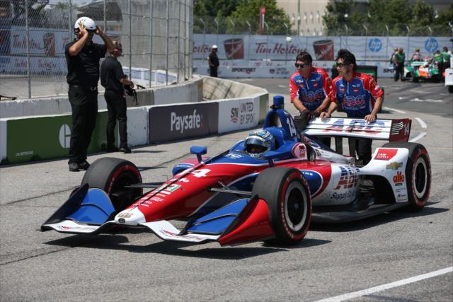 Tony Kanaan gets a push from his crew on pit lane during the final warmup for the Honda Indy Toronto -- Photo by: Chris Jones