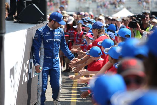 Ed Jones greets the young fans in front of the stage during pre-race introductions for the Honda Indy Toronto -- Photo by: Chris Jones