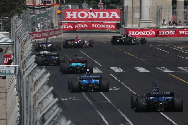 The field strings out entering Turn 1 during the Honda Indy Toronto -- Photo by: Chris Jones