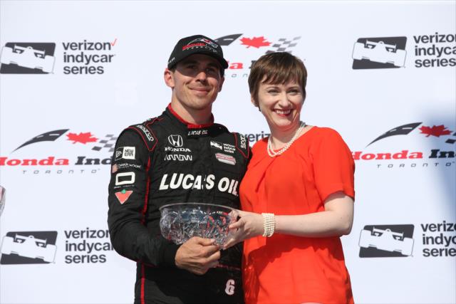 Robert Wickens is presented his 3rd Place trophy in Victory Circle following the Honda Indy Toronto -- Photo by: Chris Jones