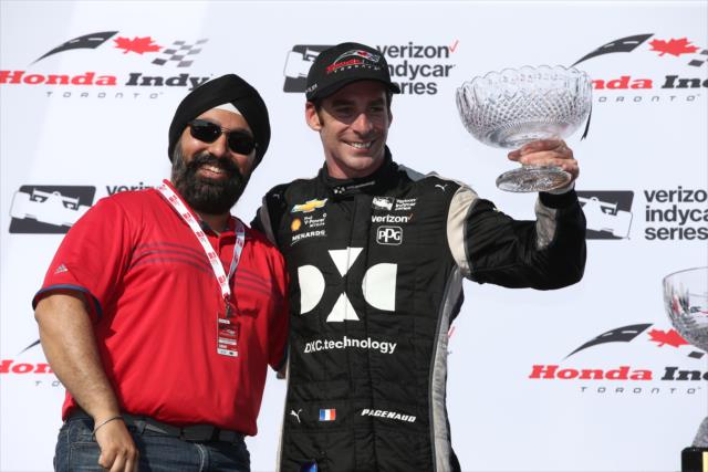 Simon Pagenaud is presented his 2nd Place trophy in Victory Circle following the Honda Indy Toronto -- Photo by: Chris Jones