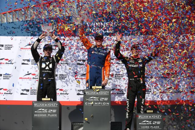 The confetti flies over the podium of Scott Dixon, Simon Pagenaud, and Robert Wickens in Victory Circle following the Honda Indy Toronto -- Photo by: Chris Jones