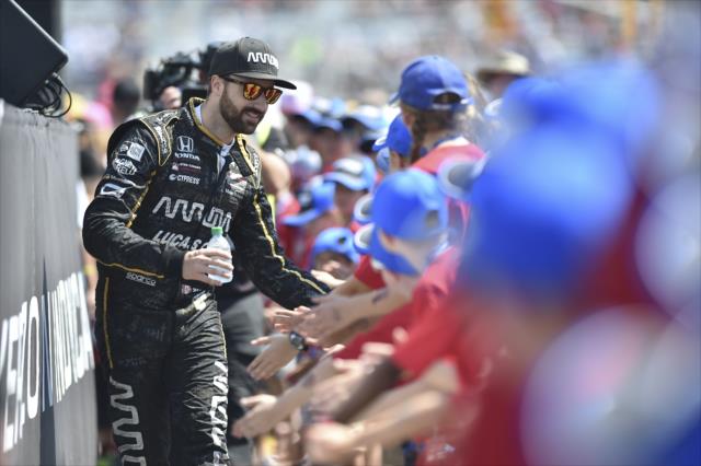 Canadian James Hinchcliffe greets the young fans lined up in front of the stage during pre-race festivities for the Honda Indy Toronto -- Photo by: Chris Owens