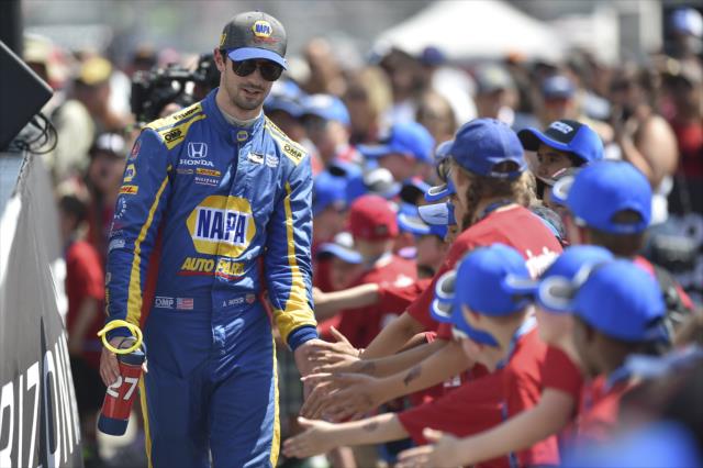 Alexander Rossi greets the young fans in front of the stage during pre-race festivities for the Honda Indy Toronto -- Photo by: Chris Owens