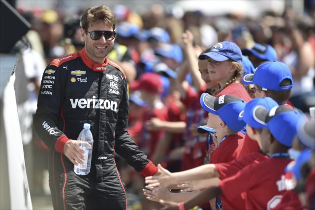Will Power greets the young fans in front of the stage during pre-race festivities for the Honda Indy Toronto -- Photo by: Chris Owens