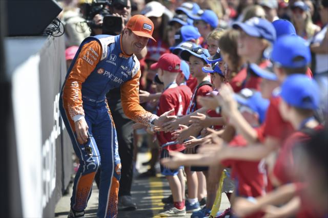 Scott Dixon greets the young fans in front of the stage during pre-race introductions for the Honda Indy Toronto -- Photo by: Chris Owens