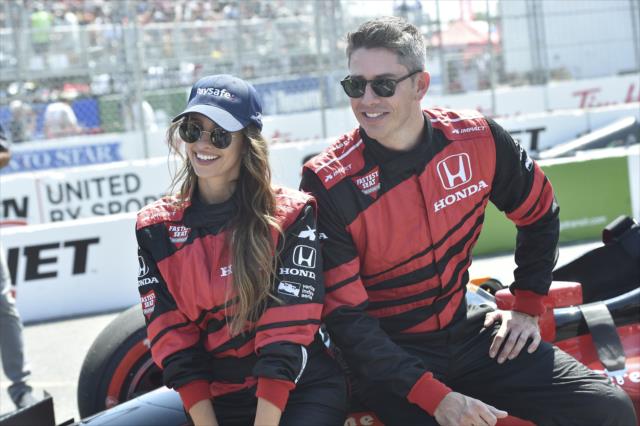 Vanessa Grimaldi and Arie Luyendyk Jr. pose for a photo during pre-race festivities for the Honda Indy Toronto -- Photo by: Chris Owens