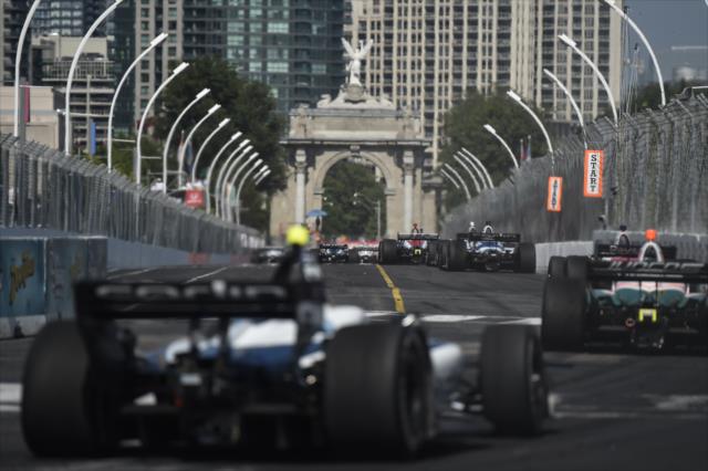 The field streams out of Turn 11 onto the frontstretch during the Honda Indy Toronto -- Photo by: Chris Owens