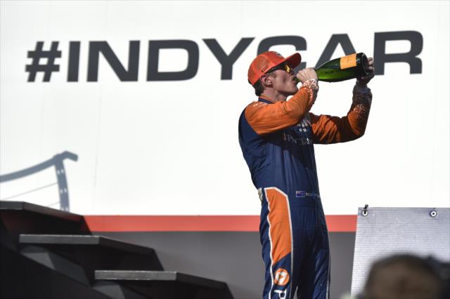 Scott Dixon sips the champagne in Victory Circle after winning the Honda Indy Toronto -- Photo by: Chris Owens