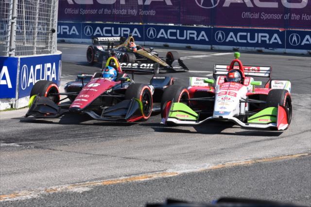 Robert Wickens and Marco Andretti go wheel-to-wheel through Turn 3 during the Honda Indy Toronto -- Photo by: James  Black
