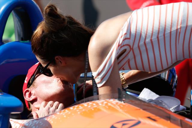 Scott Dixon receives a victory kiss from his wife, Emma, in Victory Circle after winning the Honda Indy Toronto -- Photo by: Joe Skibinski