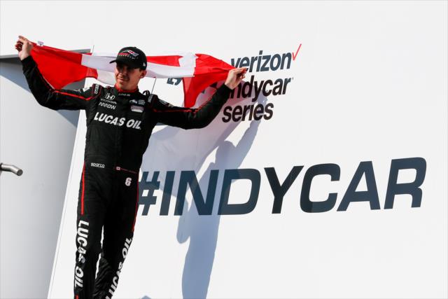 Robert Wickens with the Canadian flag in Victory Circle after his 3rd Place finish in the Honda Indy Toronto -- Photo by: Joe Skibinski