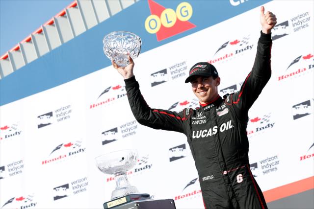 Robert Wickens hoists his 3rd Place trophy in Victory Circle following the Honda Indy Toronto -- Photo by: Joe Skibinski