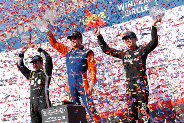 The confetti flies over the podium of Scott Dixon, Simon Pagenaud, and Robert Wickens following the Honda Indy Toronto -- Photo by: Joe Skibinski