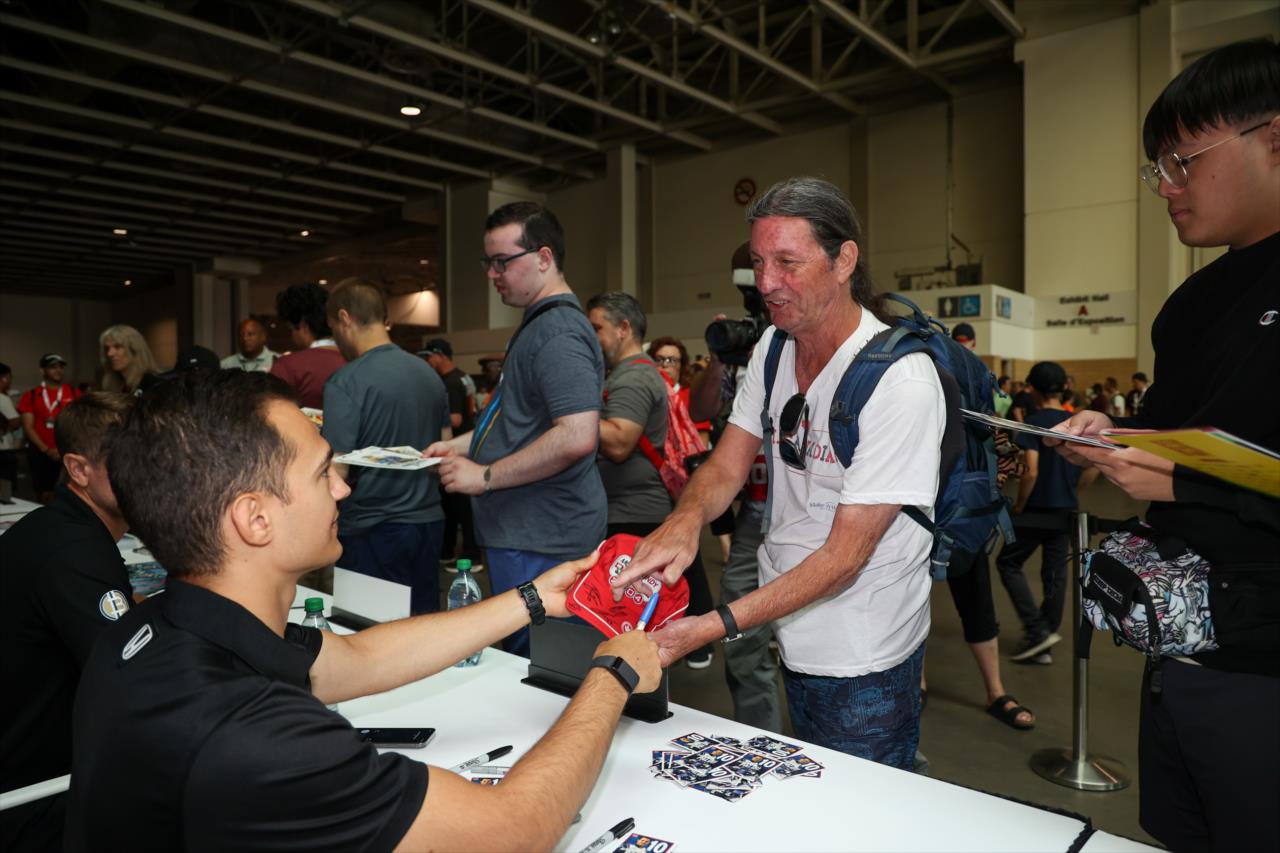 Alex Palou signs an autograph for a fan - Honda Indy Toronto - By: Travis Hinkle -- Photo by: Travis Hinkle
