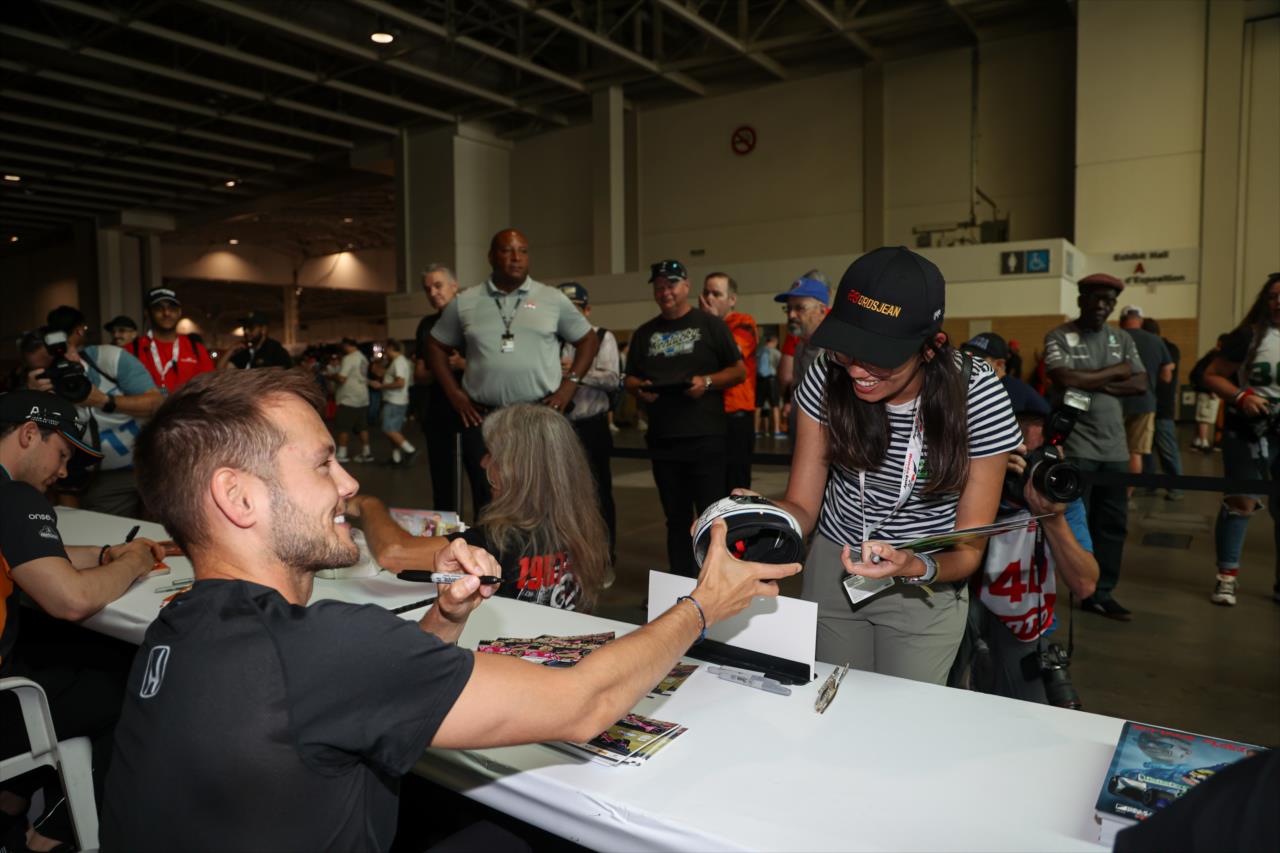 Tom Blomqvist signs an autograph for a fan - Honda Indy Toronto - By: Travis Hinkle -- Photo by: Travis Hinkle
