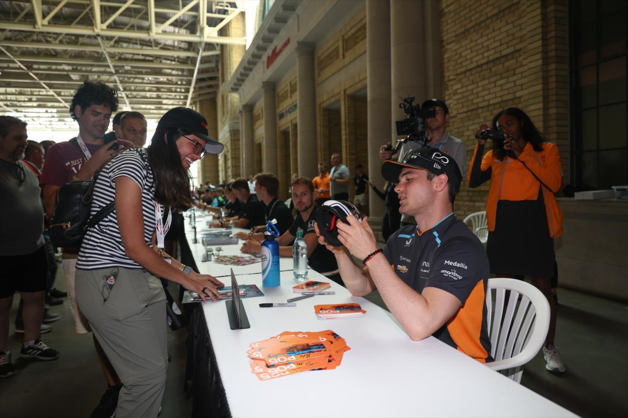 Pato O'Ward signs an autograph for a fan - Honda Indy Toronto - By: Travis Hinkle -- Photo by: Travis Hinkle