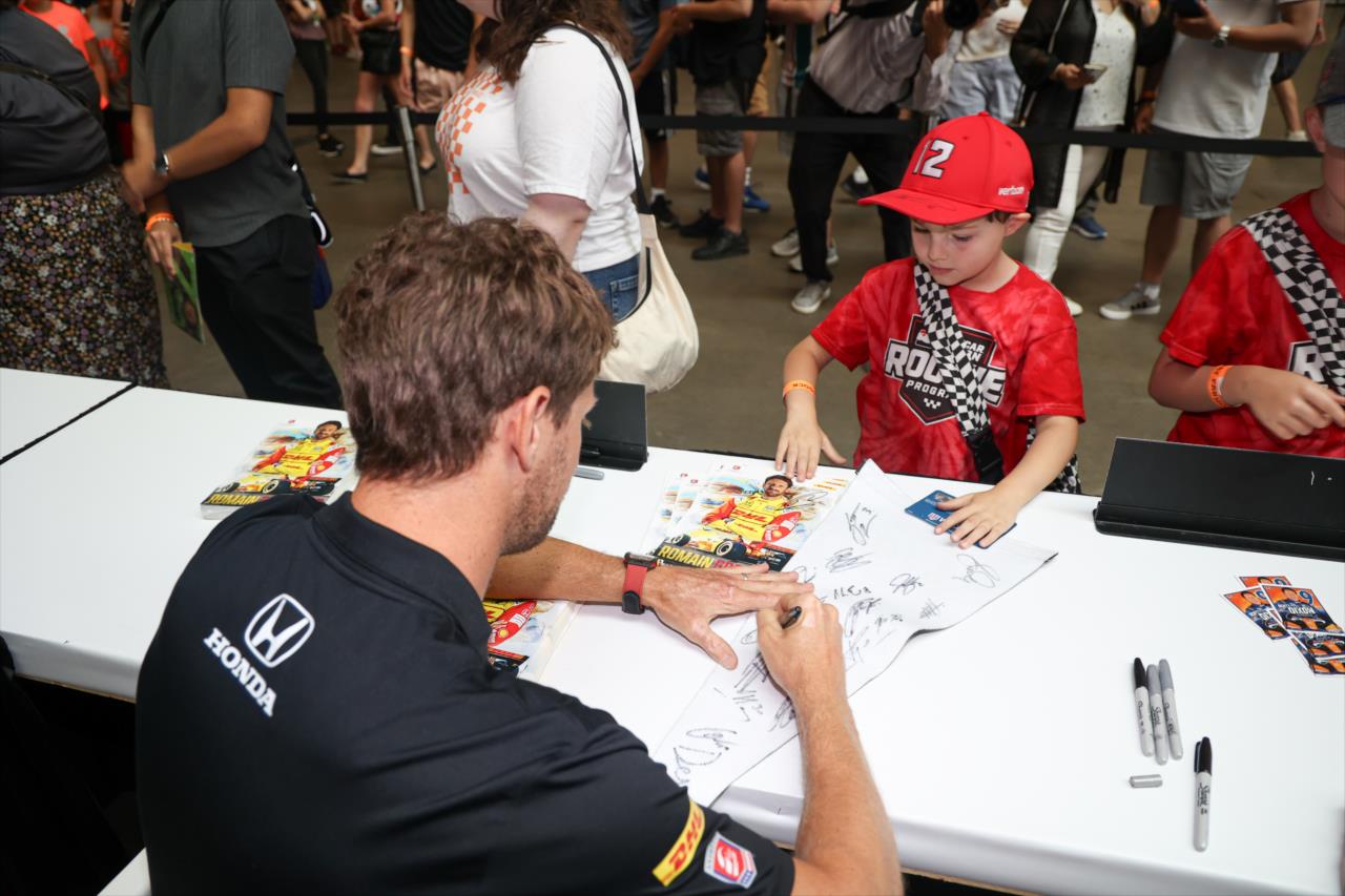 Romain Grosjean signs an autograph for a fan - Honda Indy Toronto - By: Travis Hinkle -- Photo by: Travis Hinkle