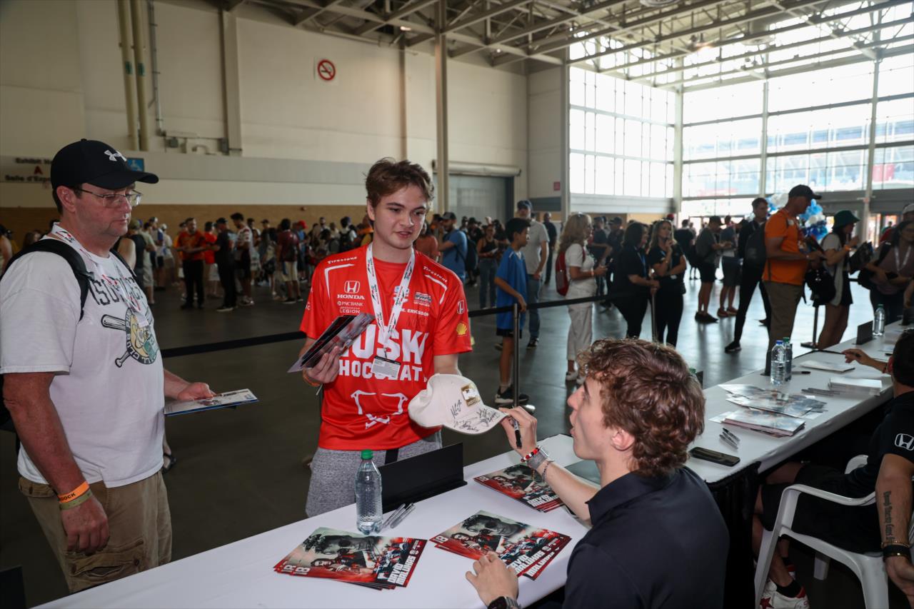 David Malukas signs an autograph for a fan - Honda Indy Toronto - By: Travis Hinkle -- Photo by: Travis Hinkle