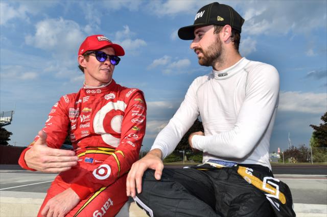 Scott Dixon and James Hinchcliffe chat along pit lane during the tire test at Watkins Glen International -- Photo by: Chris Owens