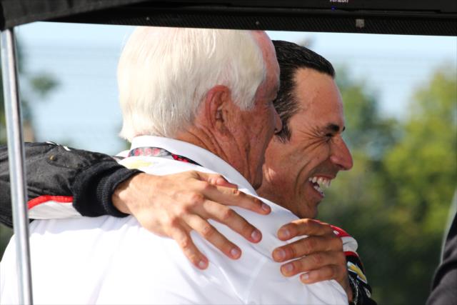 Helio Castroneves gives team owner Roger Penske a friendly hug prior to qualifications for the INDYCAR Grand Prix at The Glen at Watkins Glen International -- Photo by: Bret Kelley